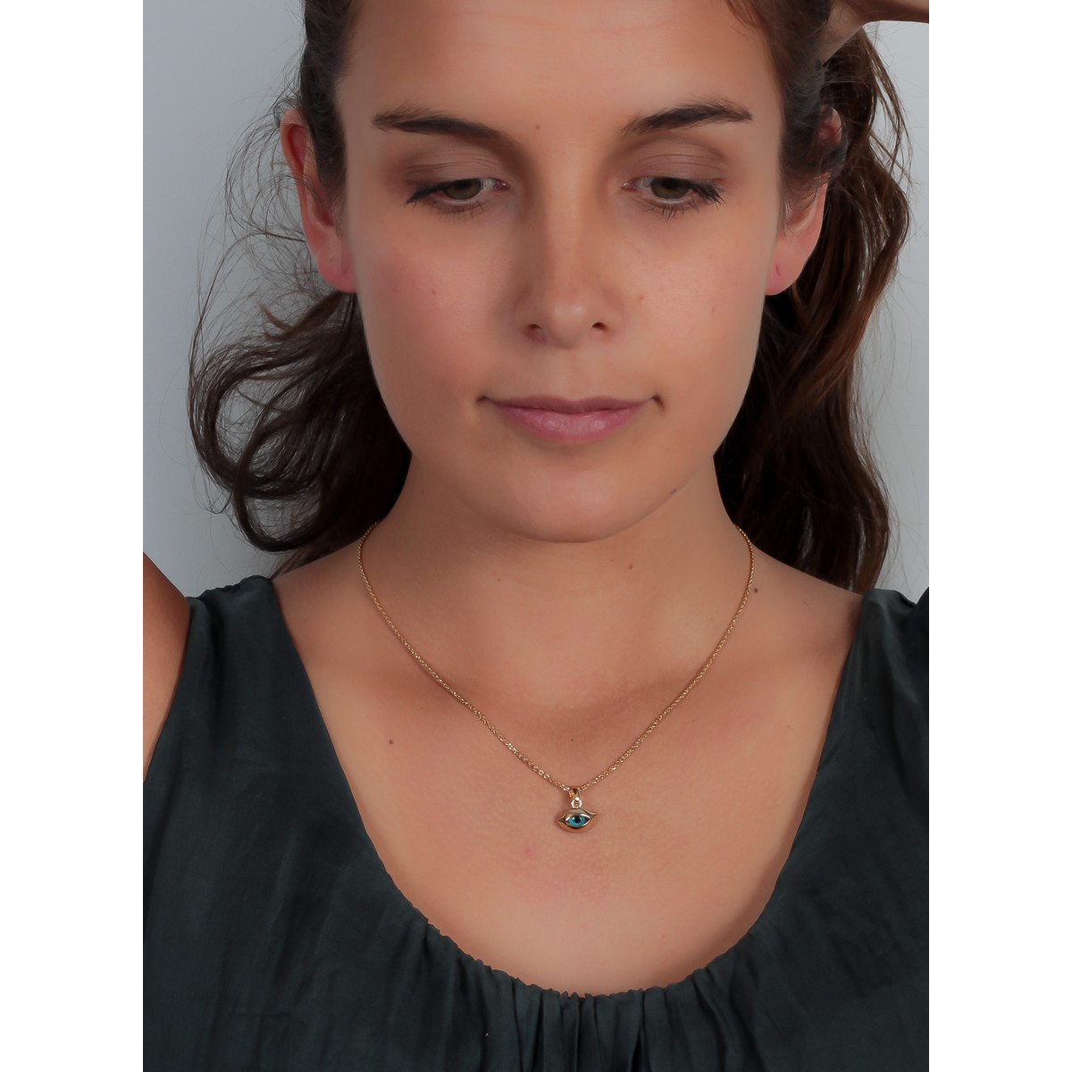 Pendentif porte bonheur plaqué or oeil bleu