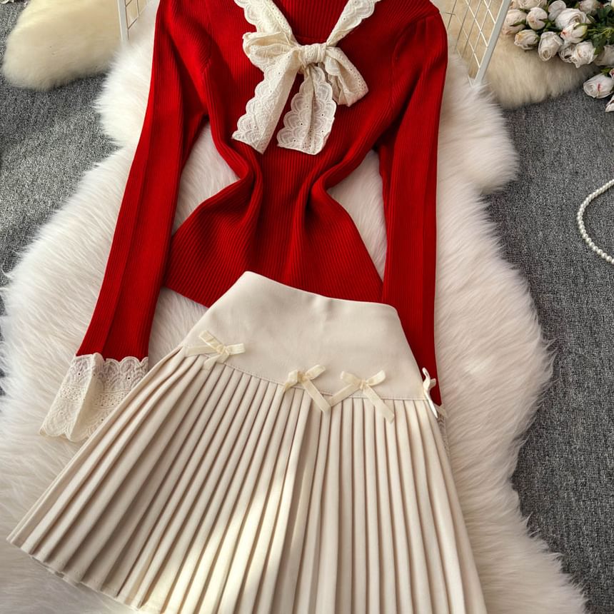Yearnin - Set: lange mouwen, effen gebreide top met lintaccent + hoge taille mini-plooirok