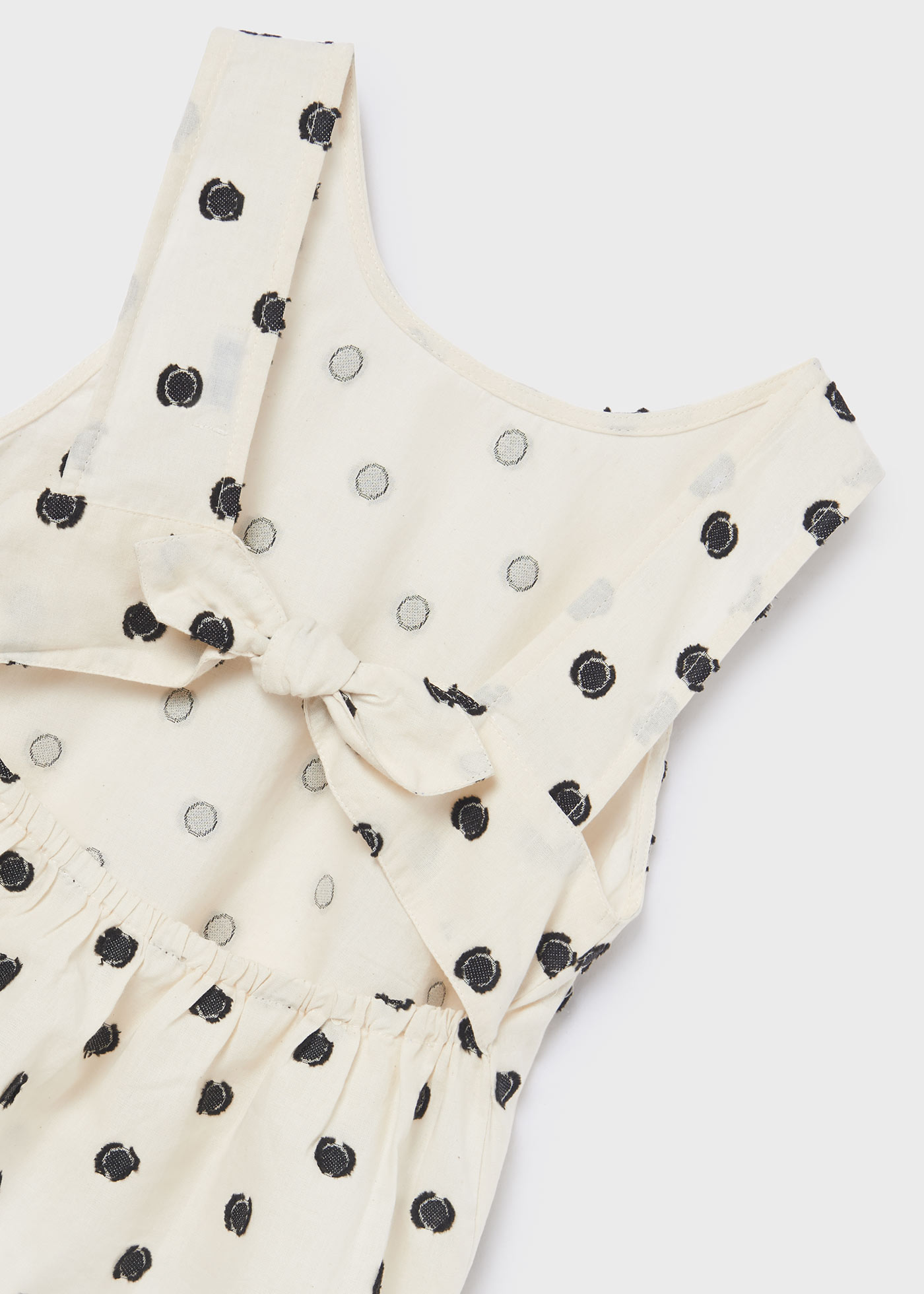 Blusa de bolinhas com laço para menina