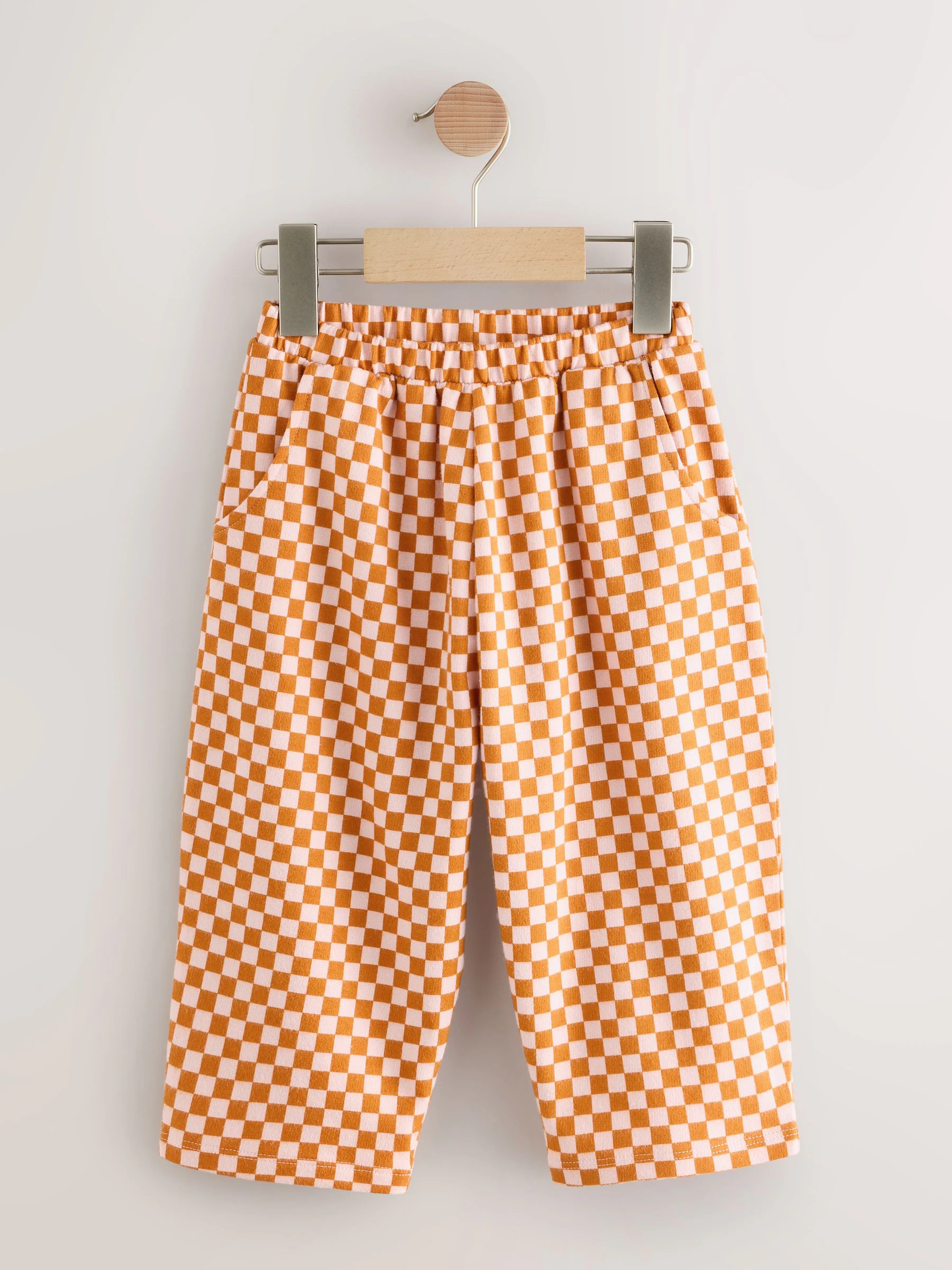 Oranje met dambordmotief - Broek met wijde kortere pijpen (3mnd -7jr)