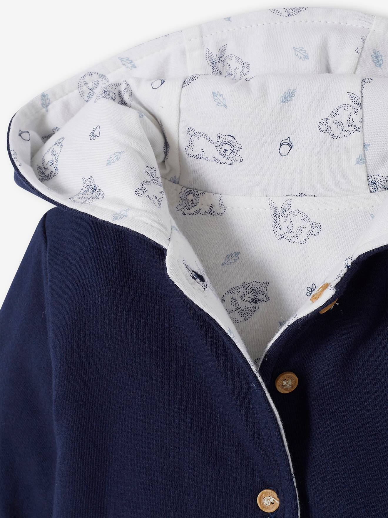Jaqueta reversível com capuz para bebê, branca lisa com estampas.
