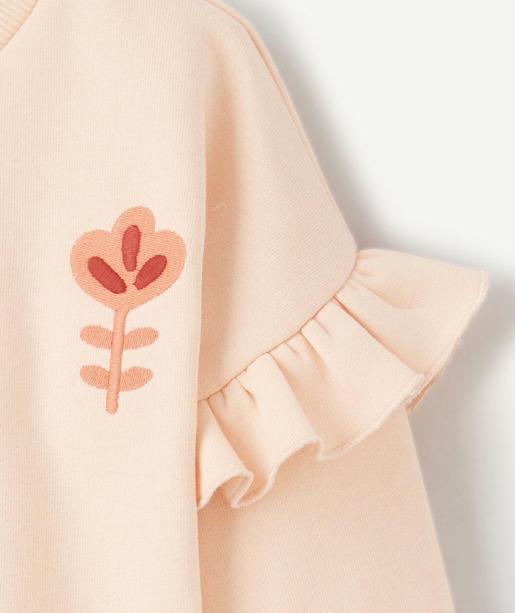 sweat bébé fille en fibres recyclées orange pâle avec volants et fleur brodée