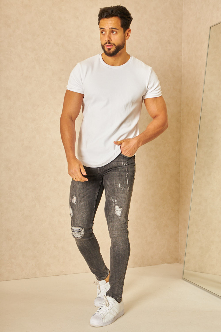 Jeans slim noir délavé déchiré