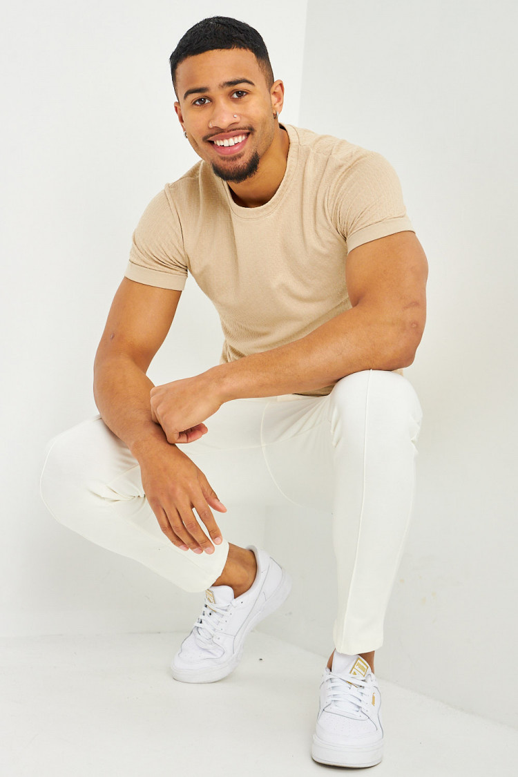 T-shirt motif relief beige manches courtes à revers