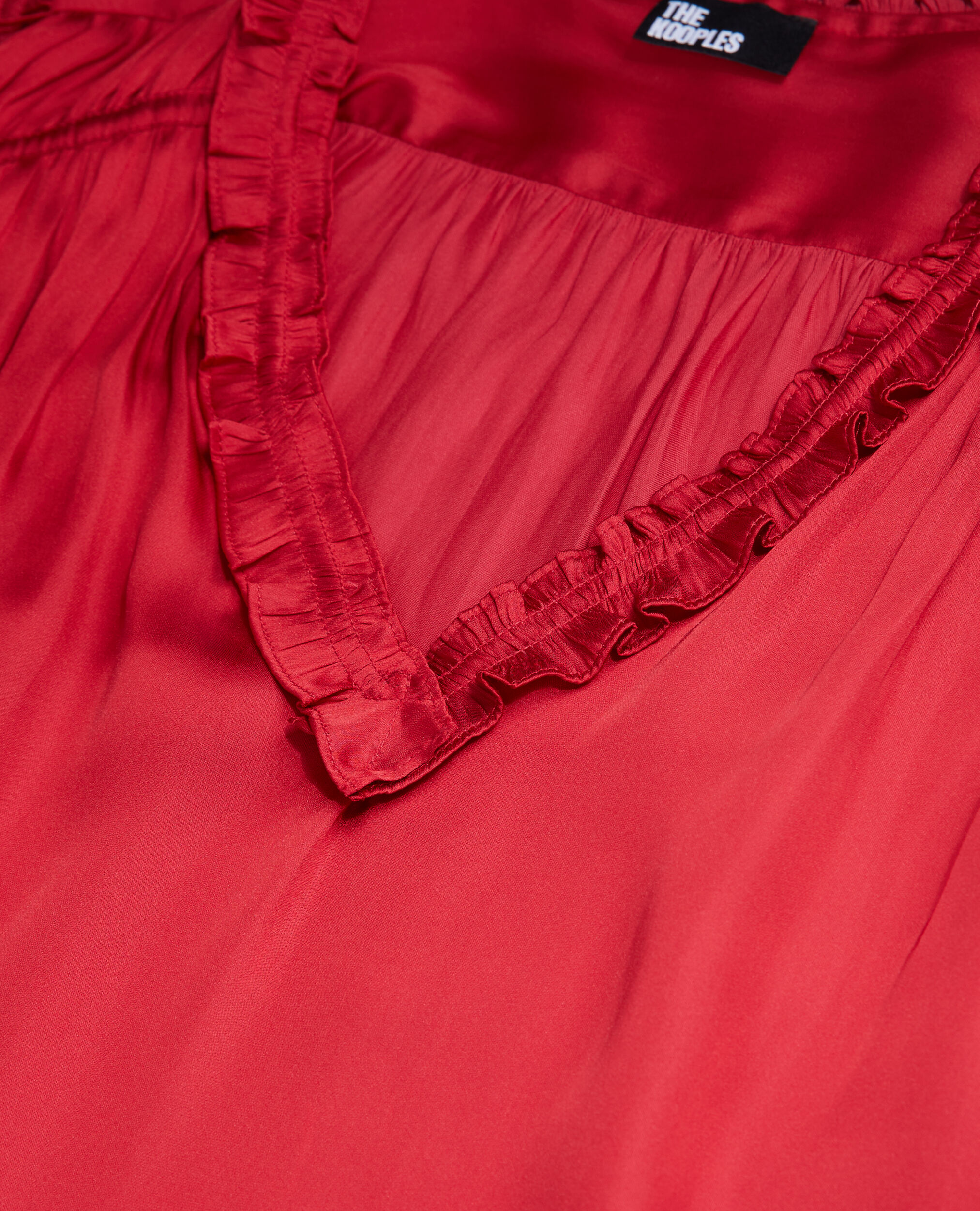 Top rouge avec fronces