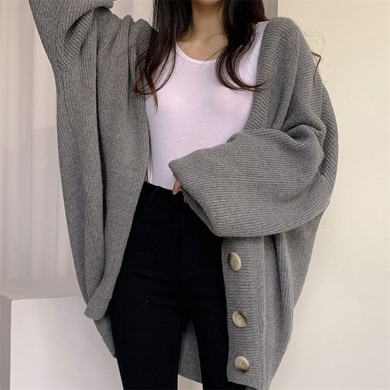 Angel Shine - Oversized V-hals vest met bubbelmouwen