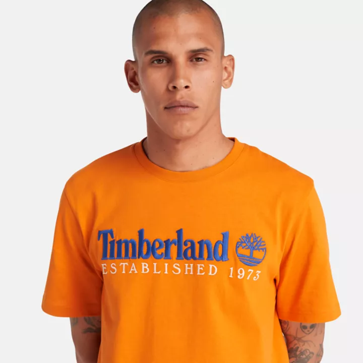 Camiseta masculina laranja da equipe Est. 1973