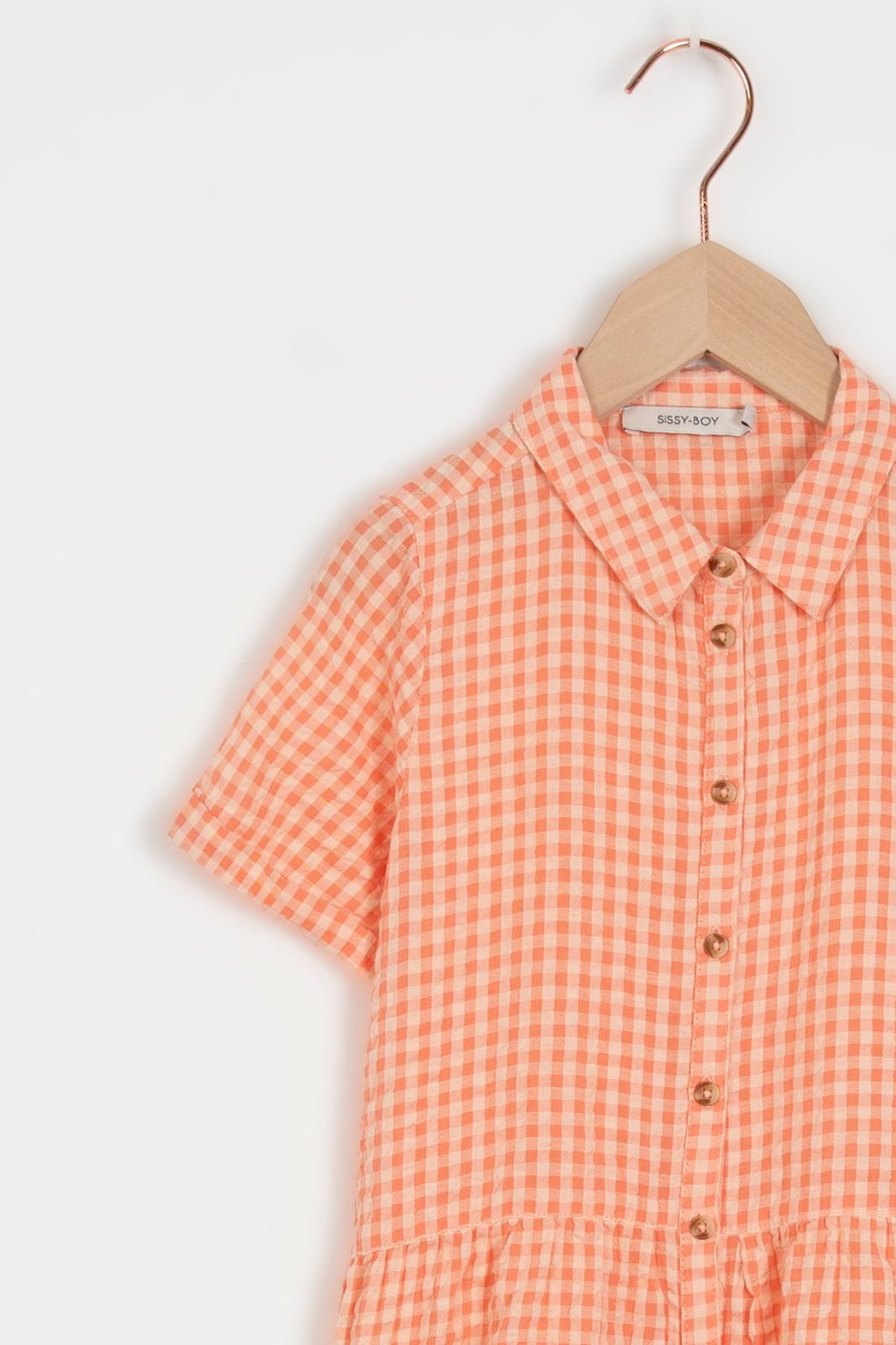 Licht oranje jurk met ruitpatroon