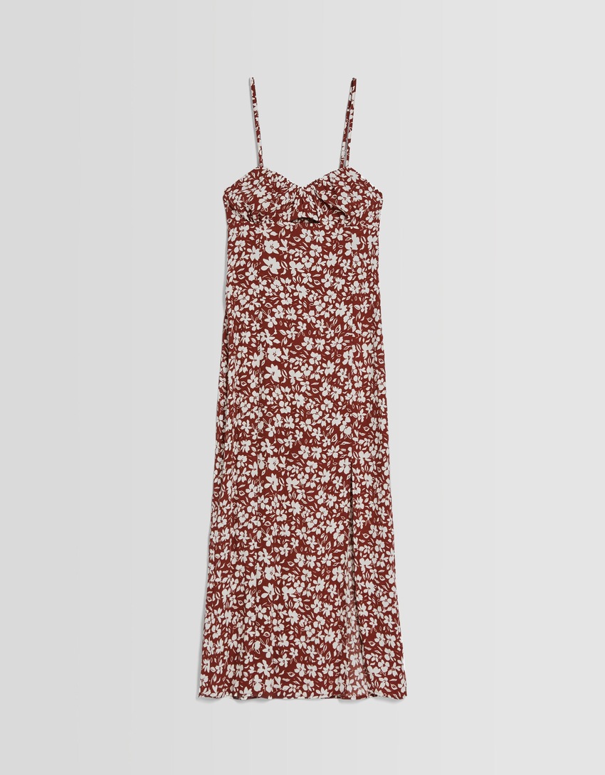 Vestido midi com estampa floral, alças e detalhe vazado.