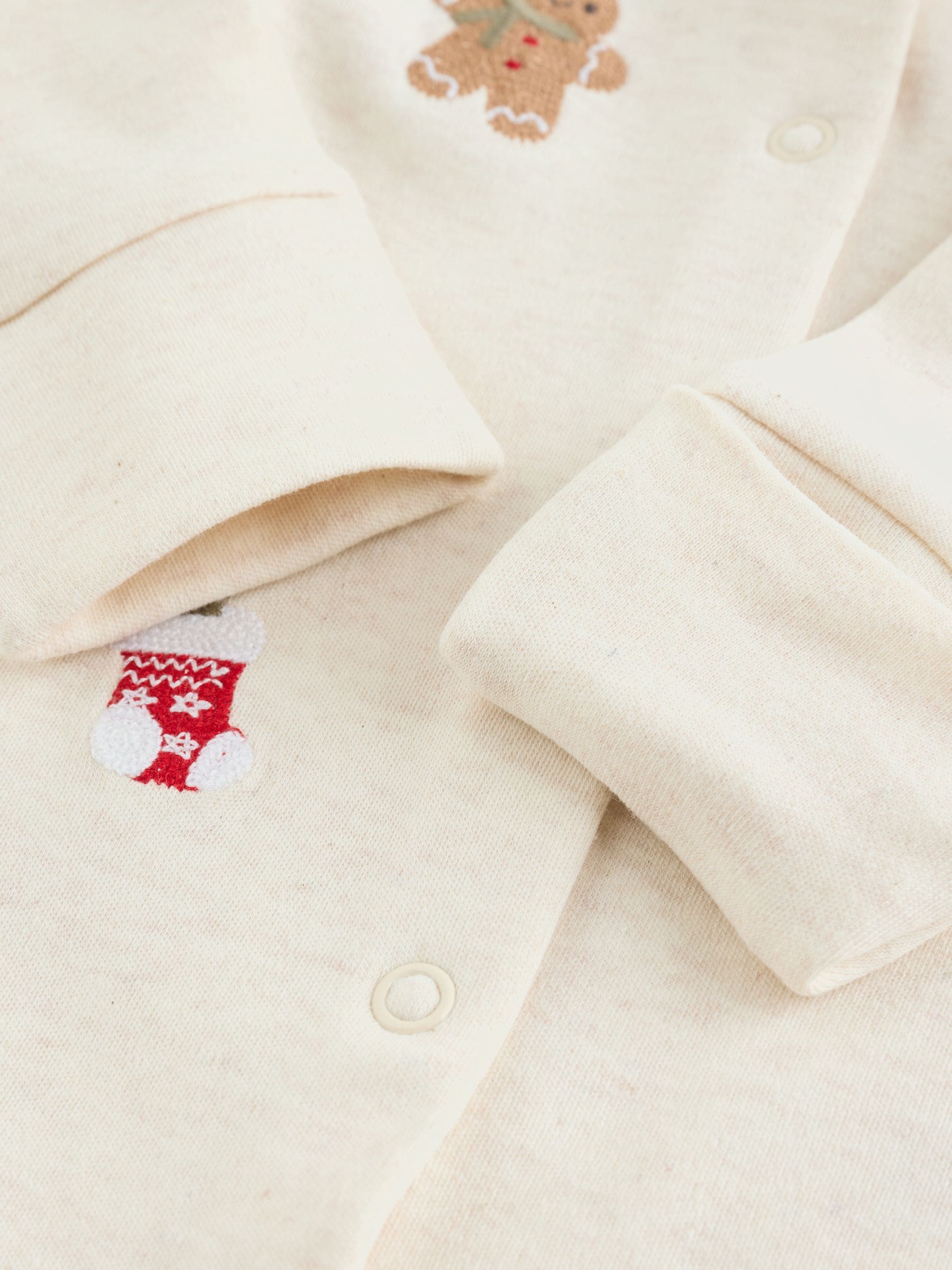 Crème - Kerstbabypyjama met figuurtjes (0mnd-3jr)