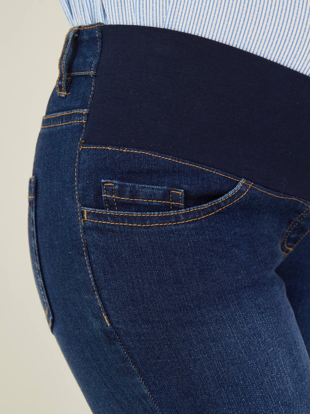 Calça jeans skinny de gestante com cintura baixa, lisa, azul escuro.