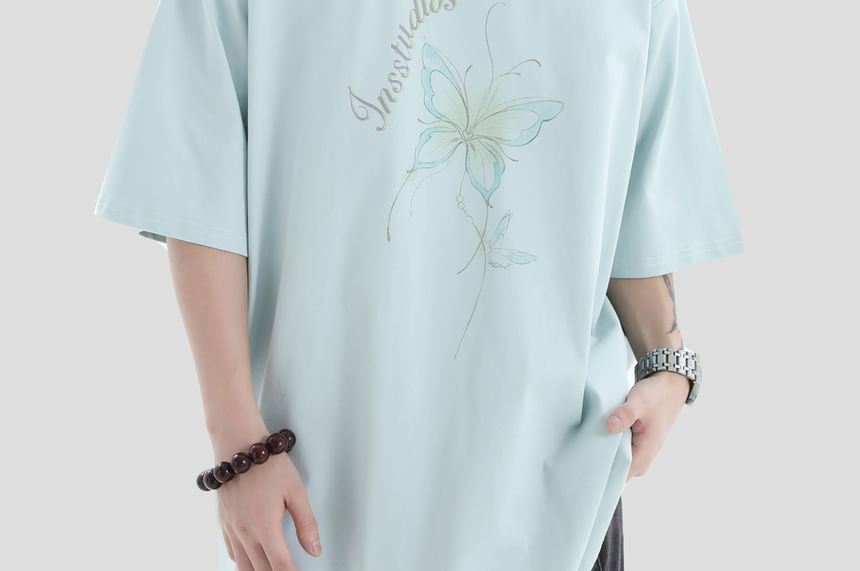 Banash - Oversized T-shirt met korte mouwen, ronde hals en vlinderprint