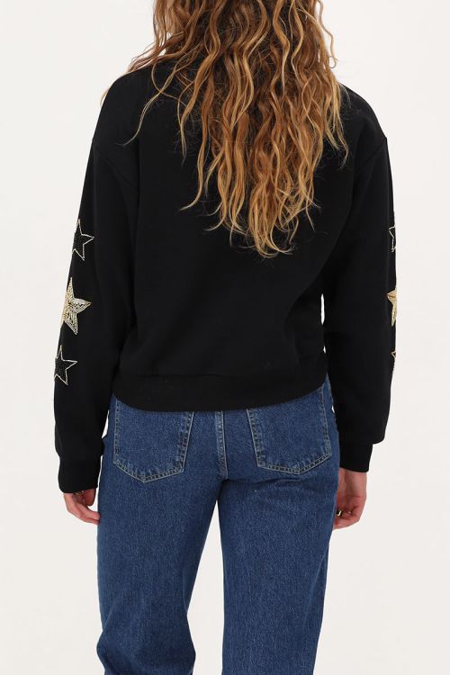 Zwarte sweater met goudkleurige sterren