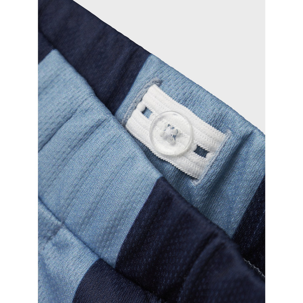 Køb Name It Dusty Blue Nmmjakari Paw Nreg Long Poly Shorts Cplg