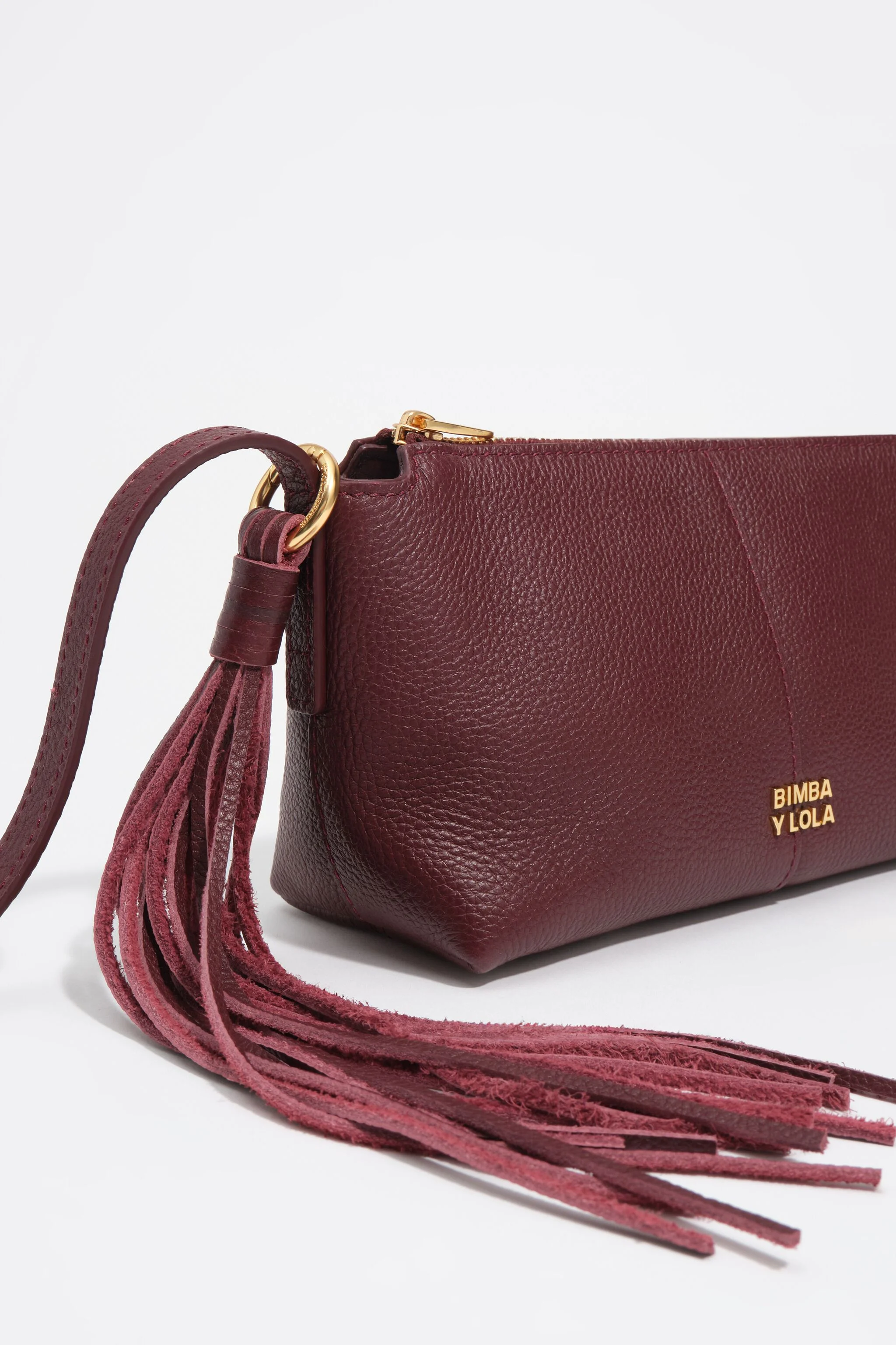 Bolsa transversal pequena em couro bordô