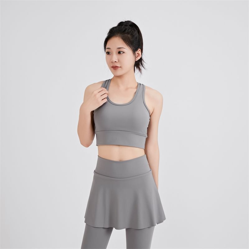 KUMI - Set: Sportieve effen bh-top + yogabroek met hoge taille en rokoverlay