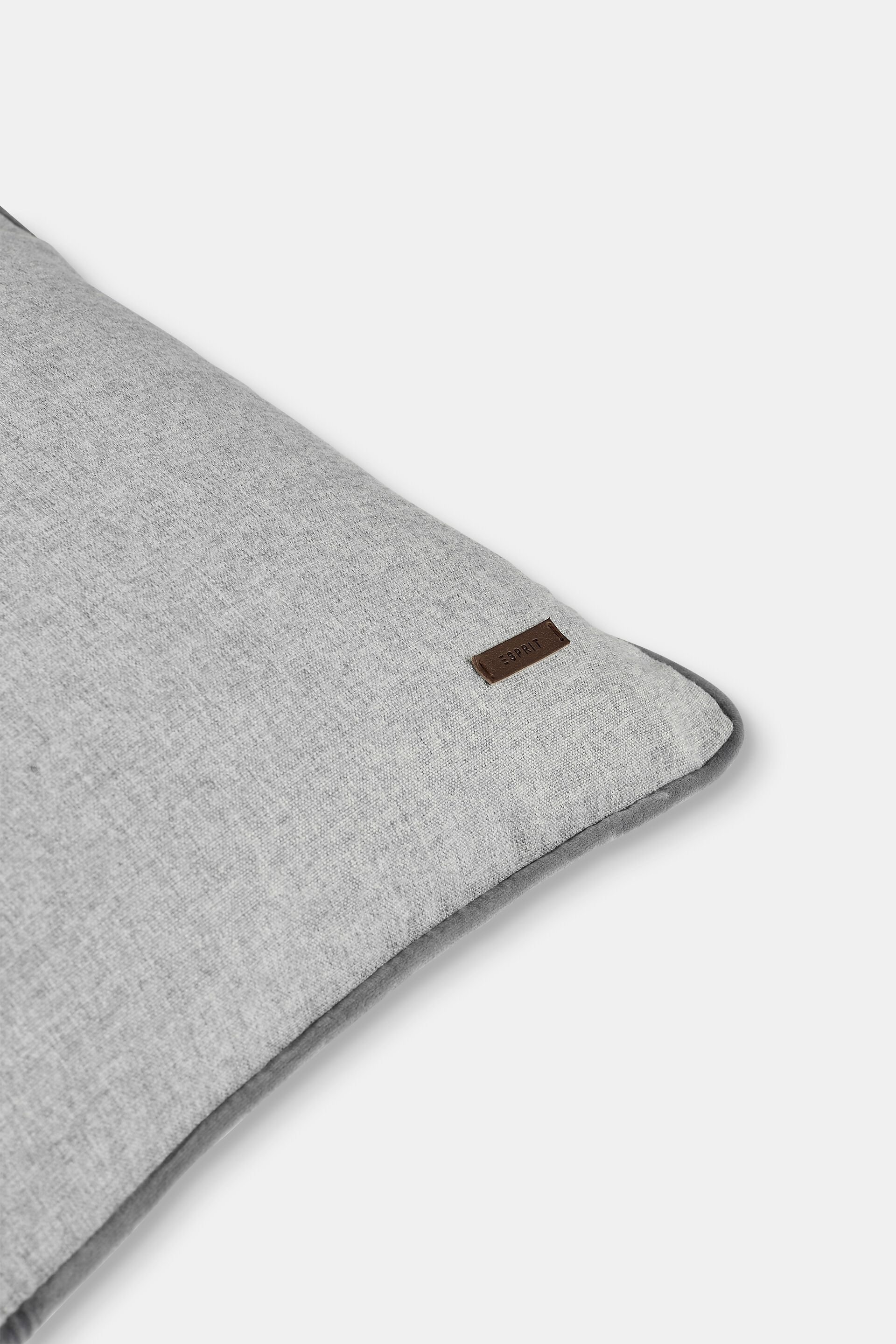 Housse de coussin décorative rehaussée d’un passepoil en velours