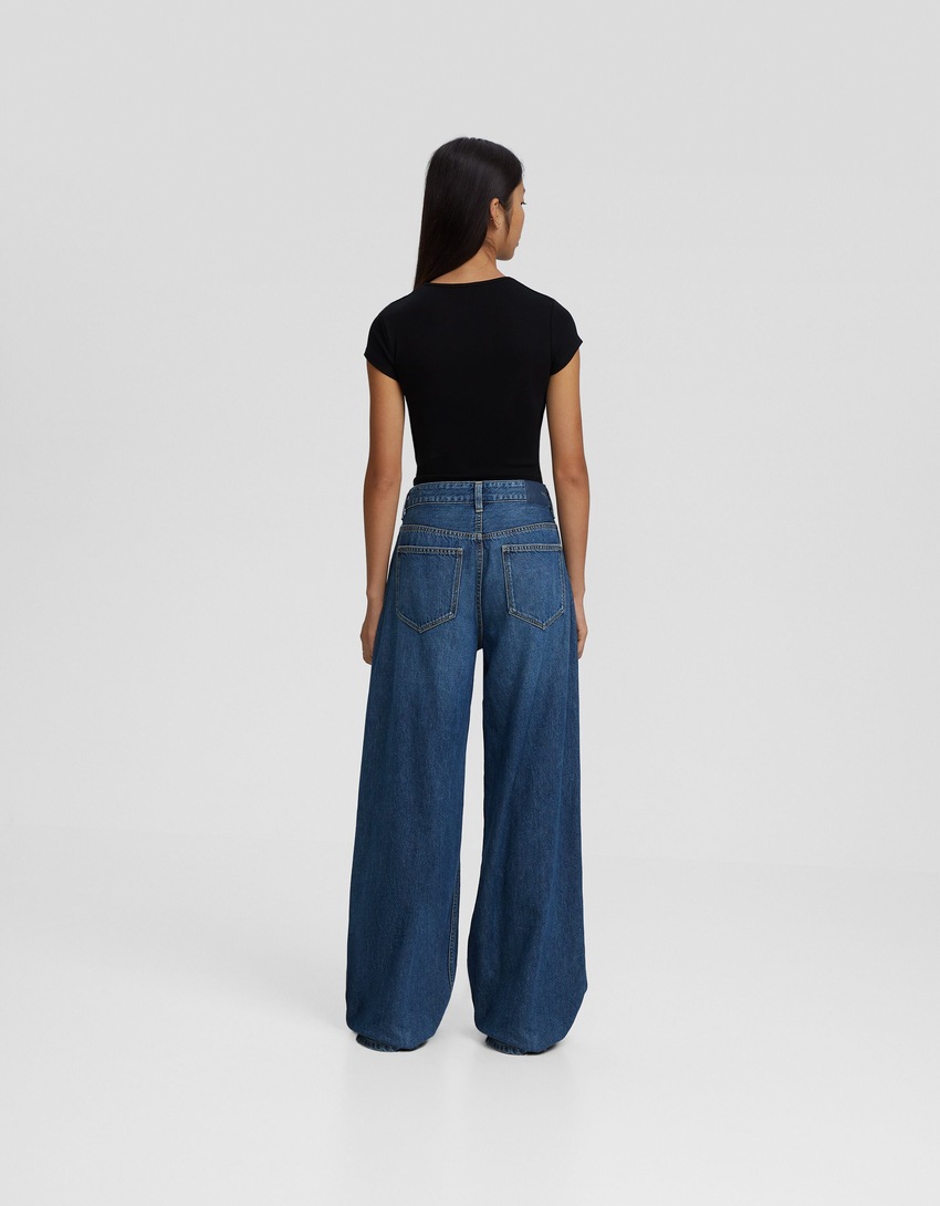 calça jeans de perna larga