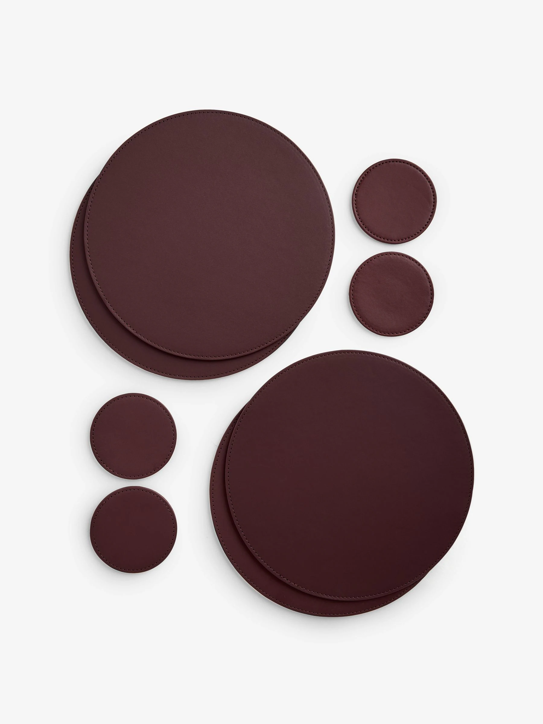 Set van 4 omkeerbare placemats en onderzetters van imitatieleer