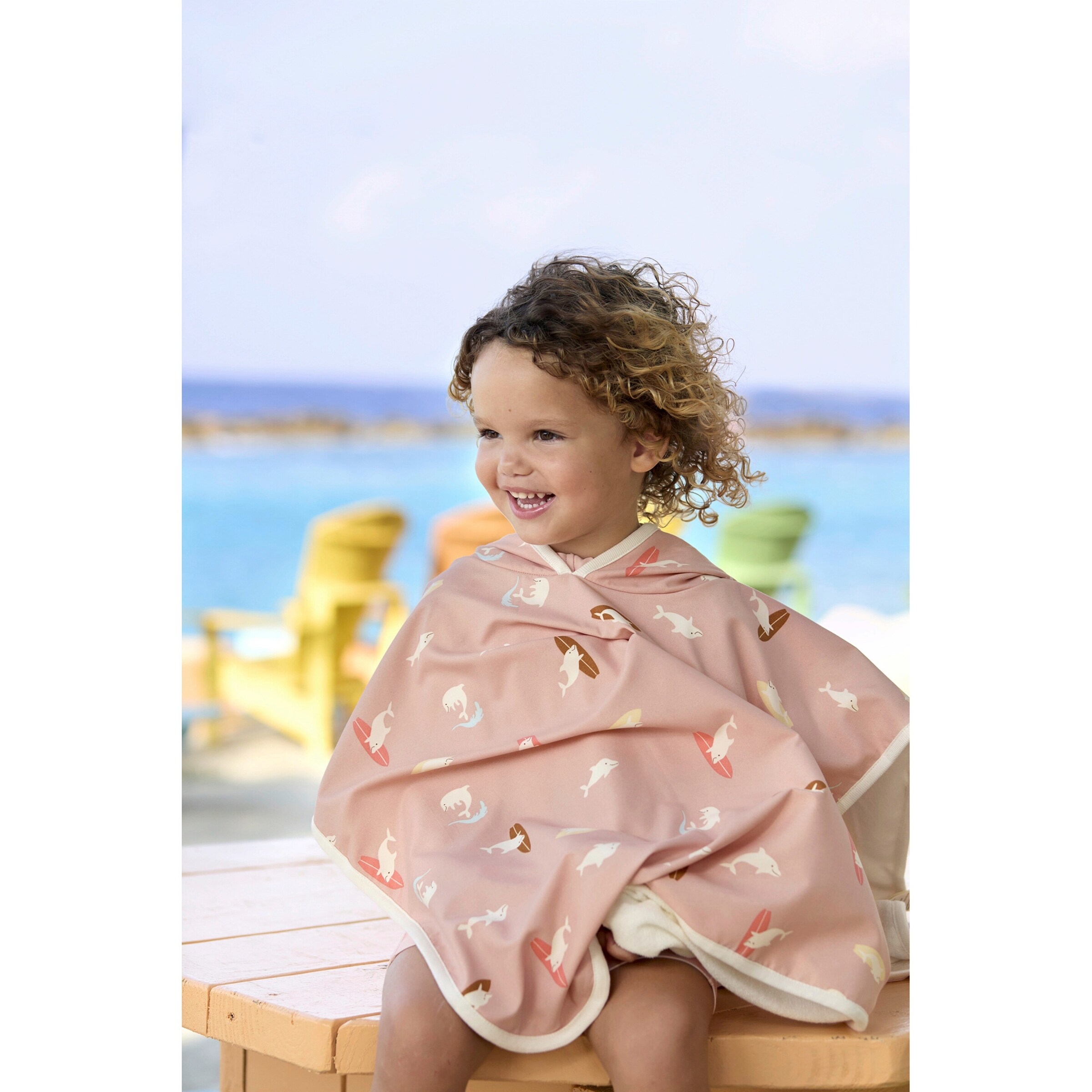 Lässig Wende-Badeponcho mit UV-Schutz und Kapuze Delfine rosa/bunt