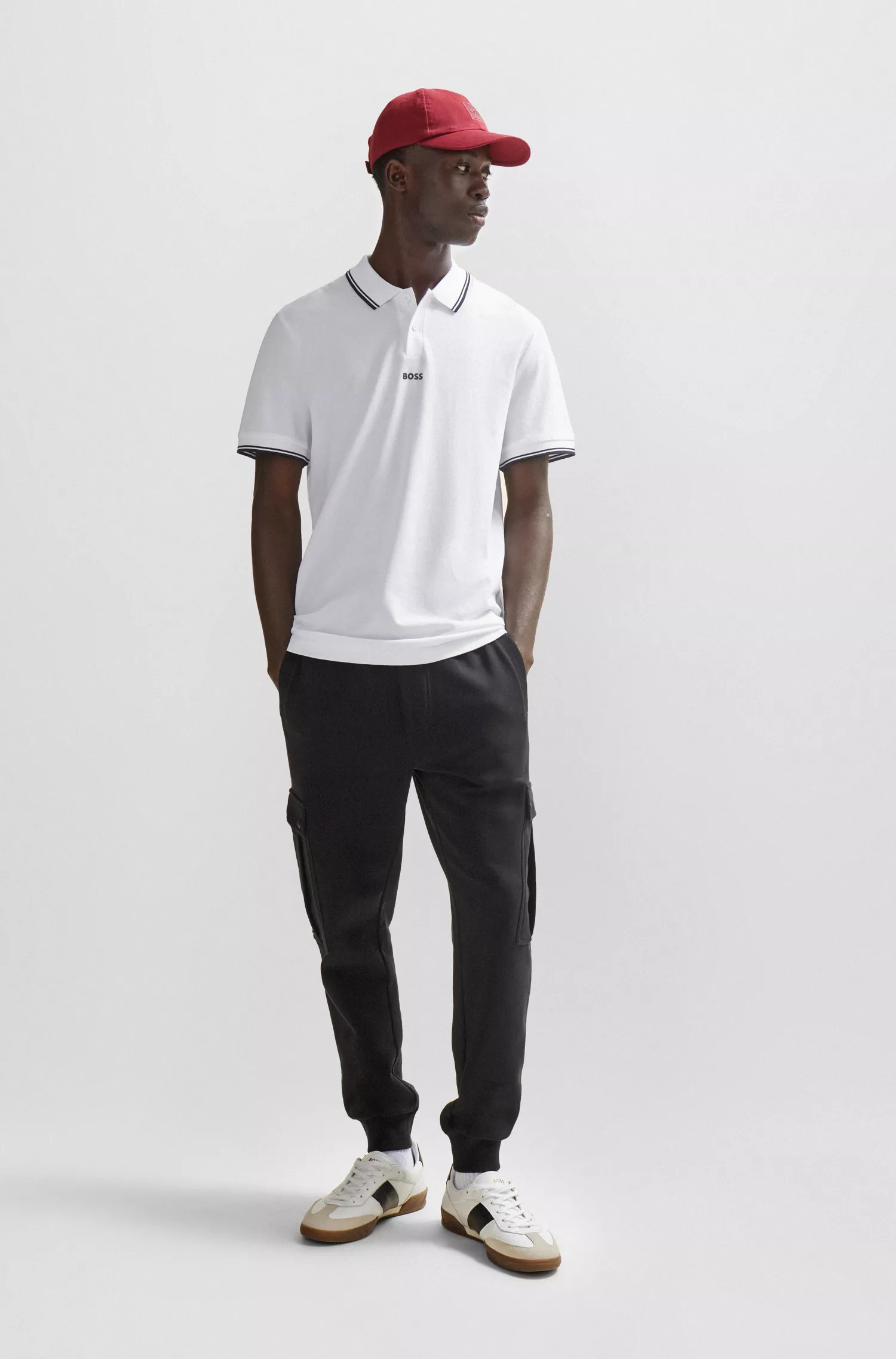 Camisa polo BOSS laranja em piqué de algodão com logotipo e detalhes contrastantes.