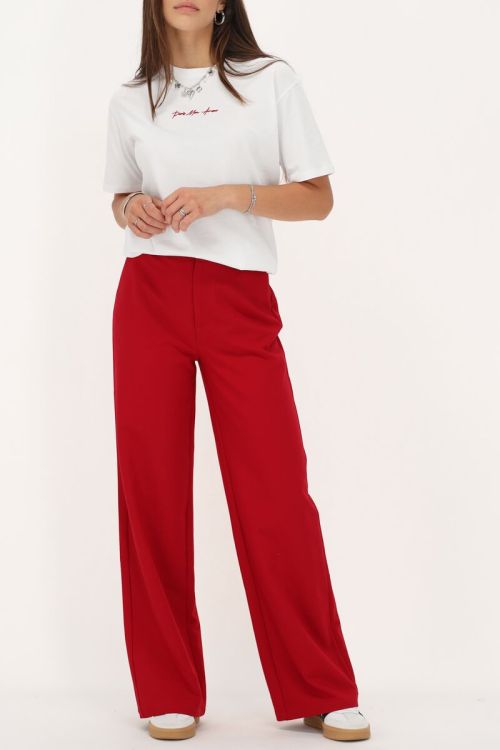 Rode pantalon met blinde knoop