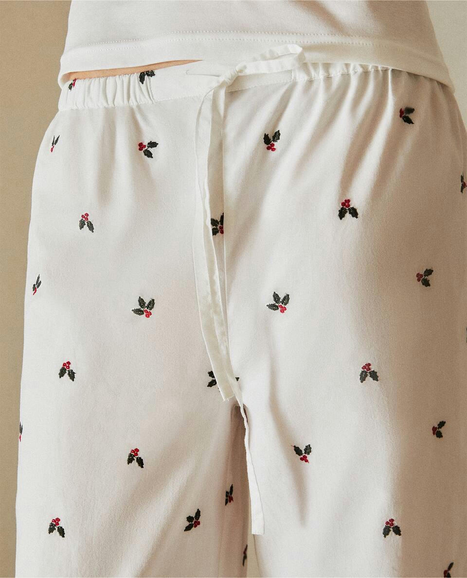 Calça de pijama de algodão com azevinho natalino