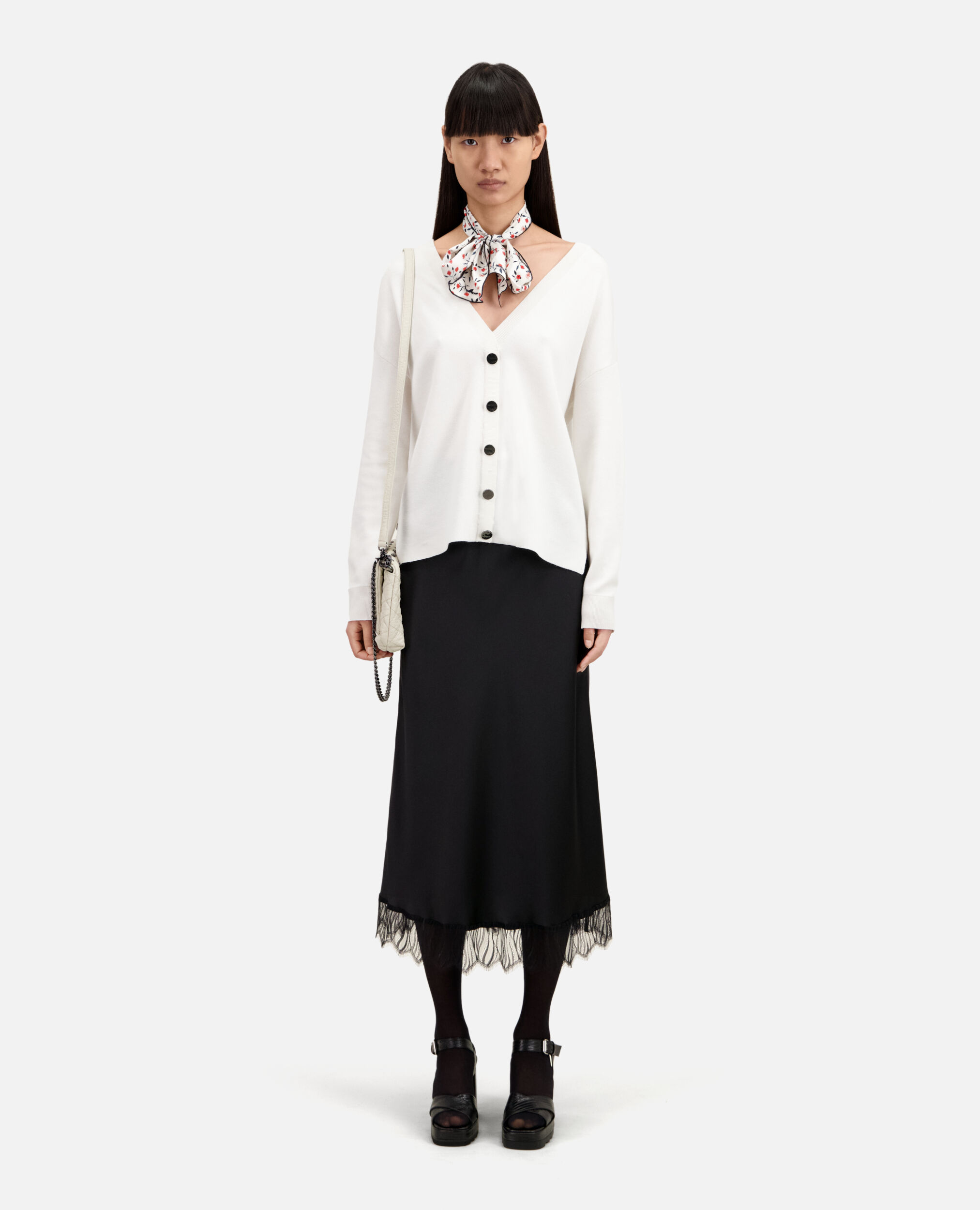 Ecru sweater with buttoning on the back