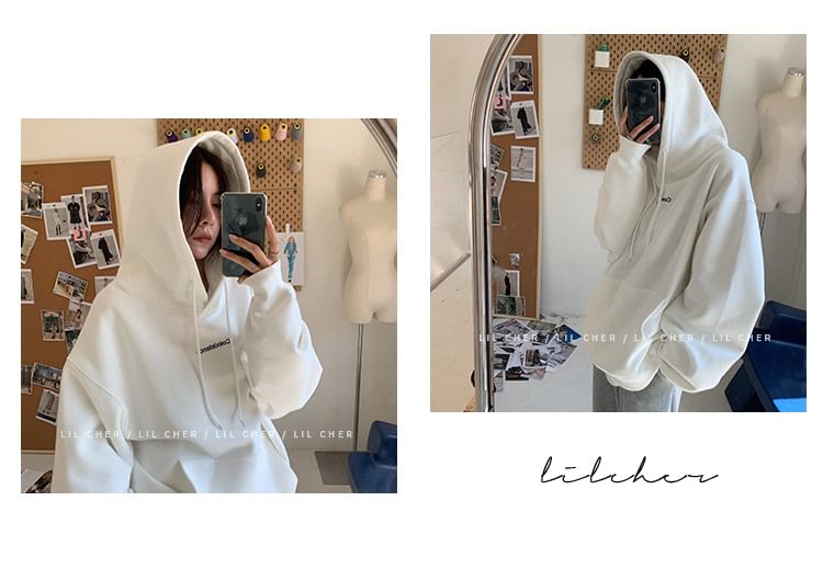 CRIBI - Oversized hoodie met ronde hals en tekstprint
