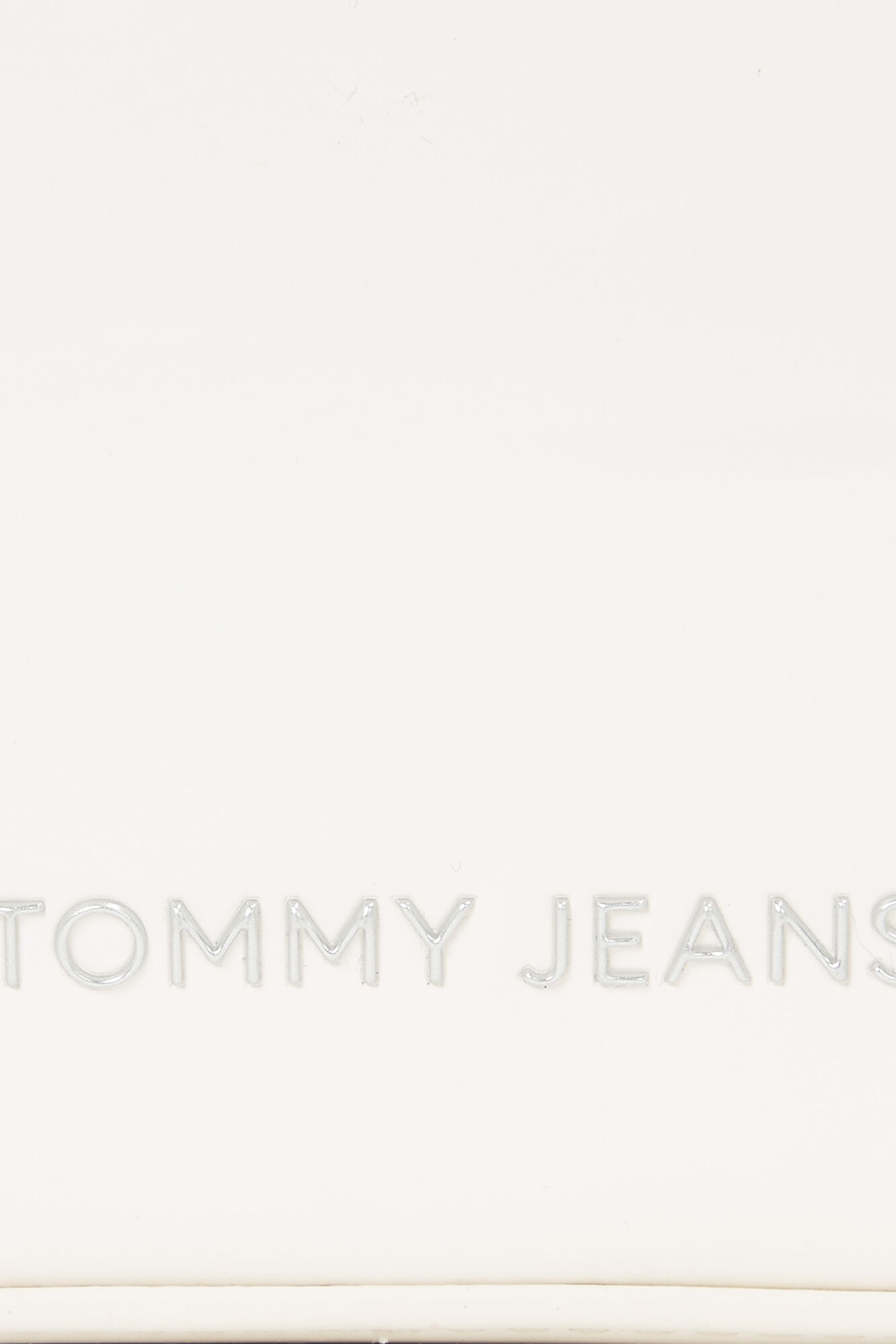 Bolsa feminina Tommy Jeans em couro envernizado com alça ajustável e zíper.