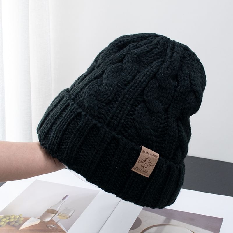 Raconteur - Gebreide muts met appliqué