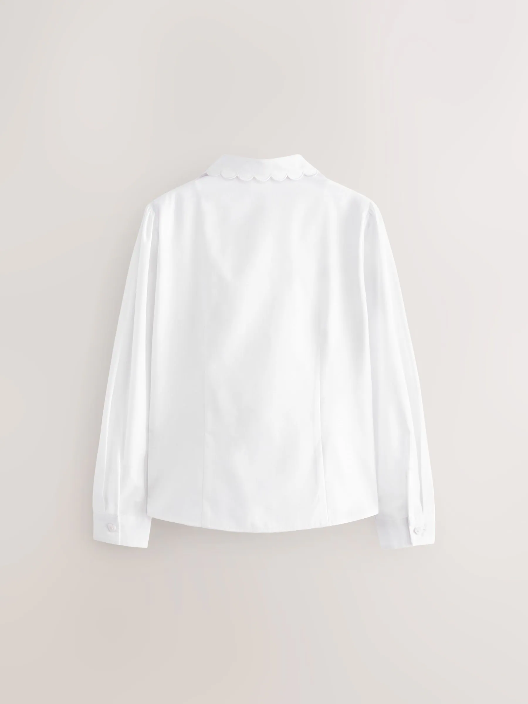 Wit - Schoolblouse met lange mouwen en gegolfde kantafwerking (3-14 jr)
