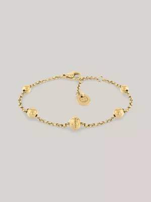Pulseira em aço inoxidável banhada a ouro com detalhe de esfera metálica