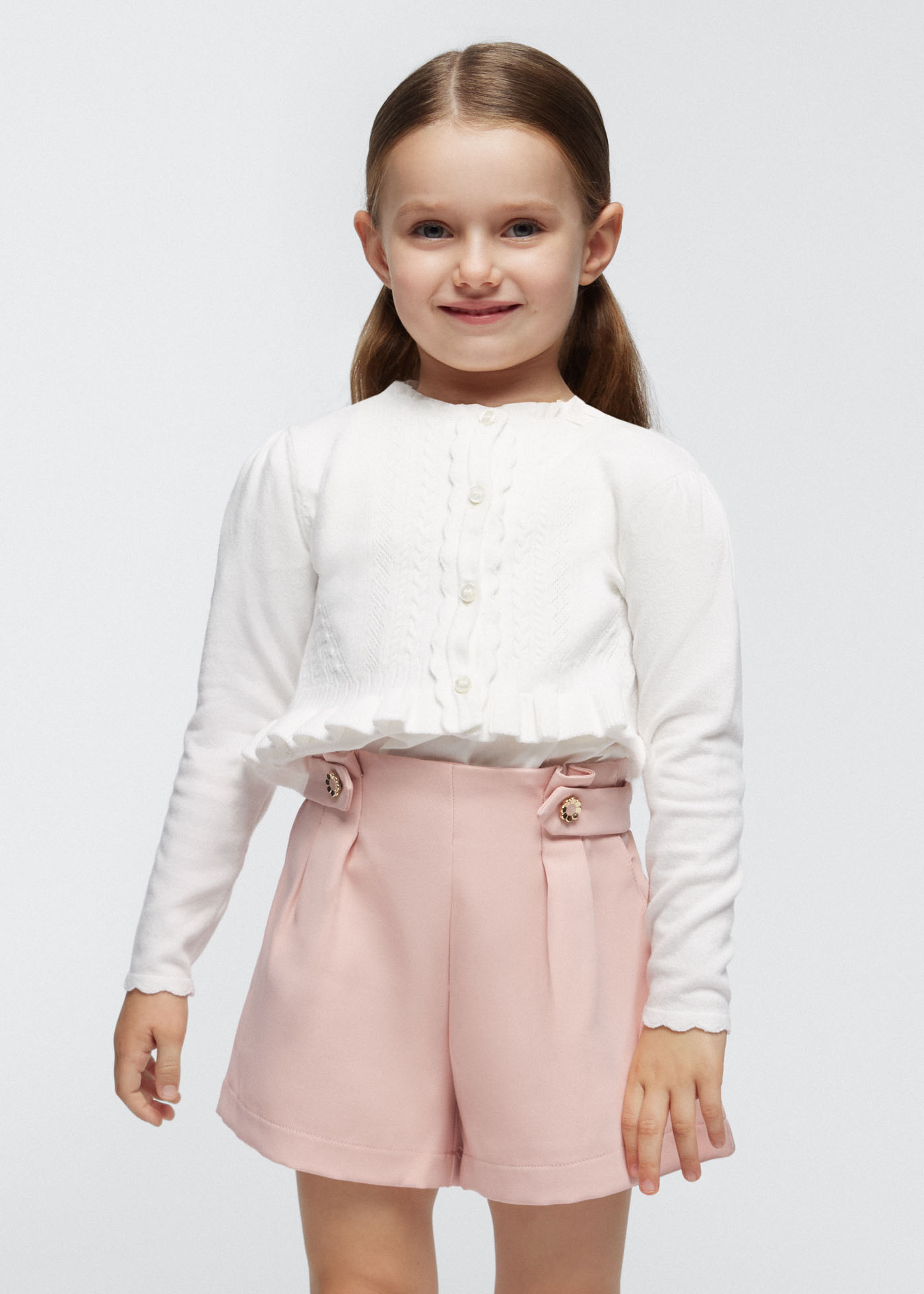 Casaquinho Better Cotton com detalhes vazados para meninas, cor fúcsia.