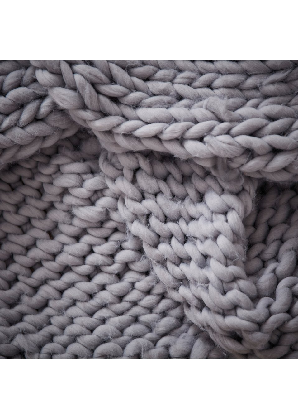 Couverture douillette en grosse maille