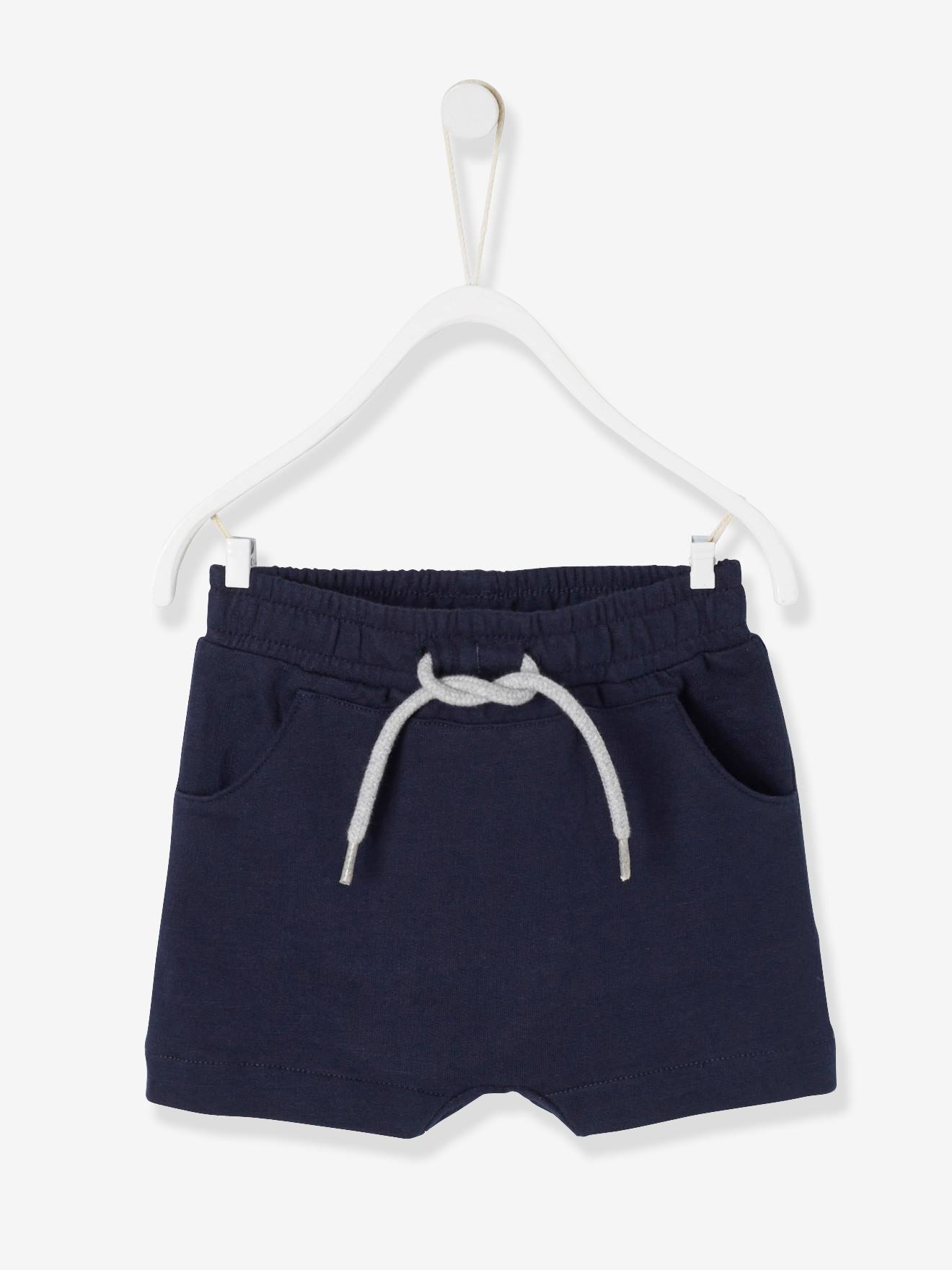 Bermuda de lã polar para bebê menino. Azul escuro liso.