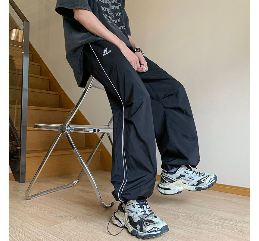 Posive - Gestreepte joggingbroek met wijde pijpen en trekkoordtaille