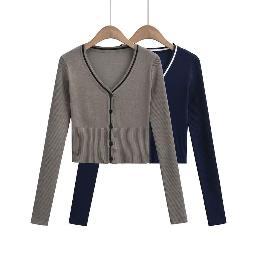 Sundine - V-hals vest met contrasterende bies en knoopjes