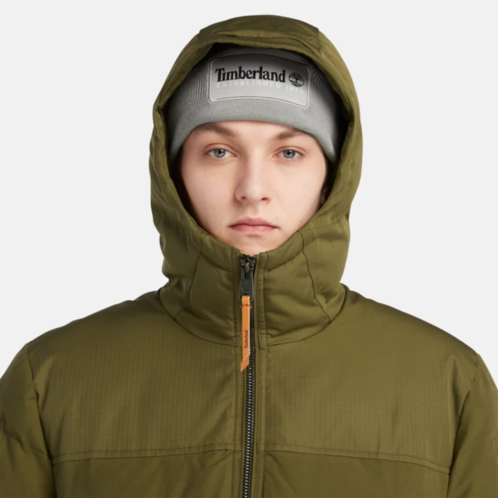 Jaqueta puffer impermeável com capuz Mountain Welch para homens na cor verde.