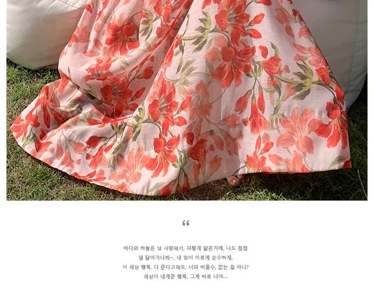 Moanum - Mouwloze maxi-zonjurk met diepe V-hals en bloemenprint