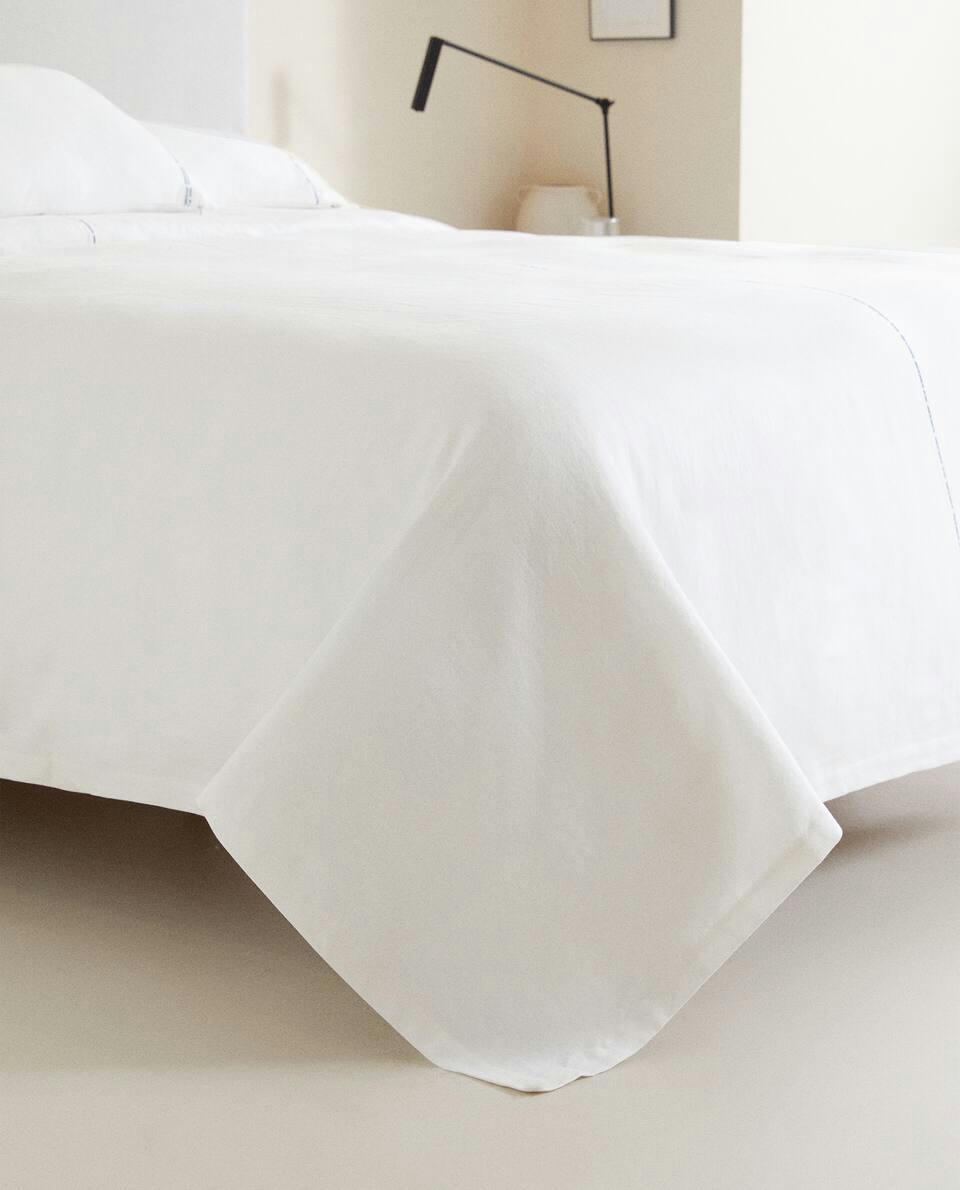 Colcha com costura decorativa