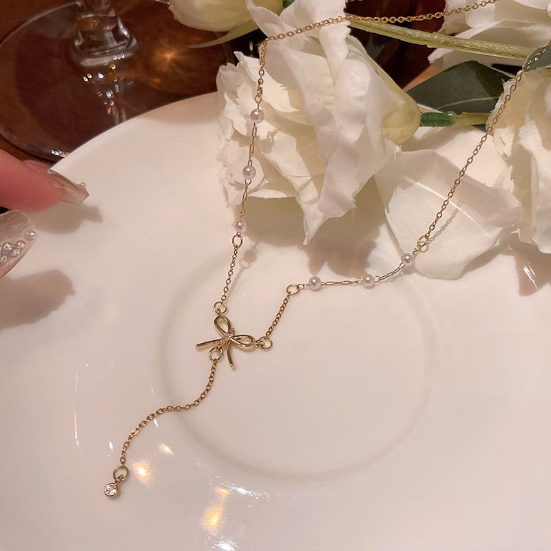 LIVSIA - Ketting met strik en nepparels