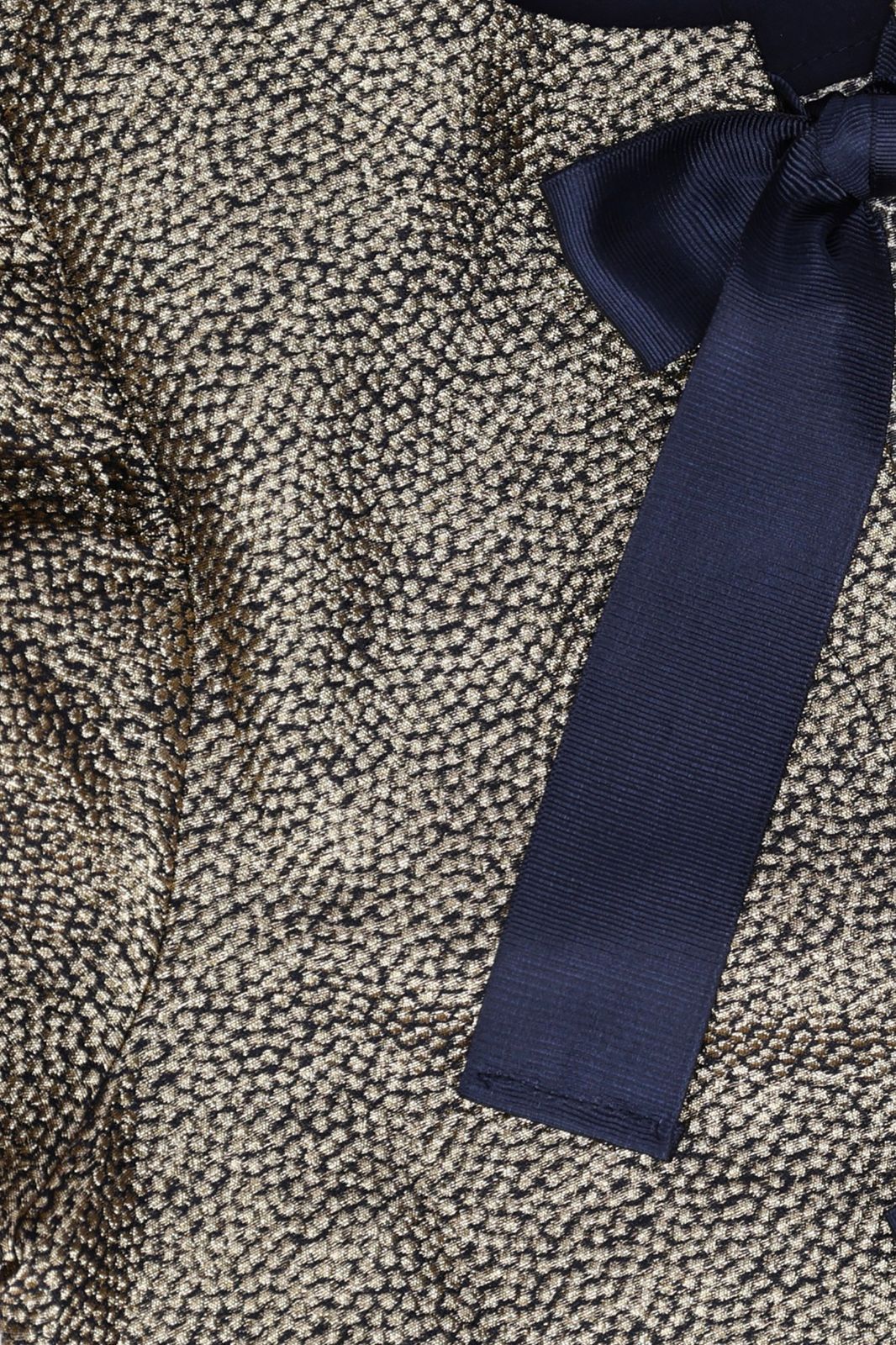 Gouden metallic top met strikdetails