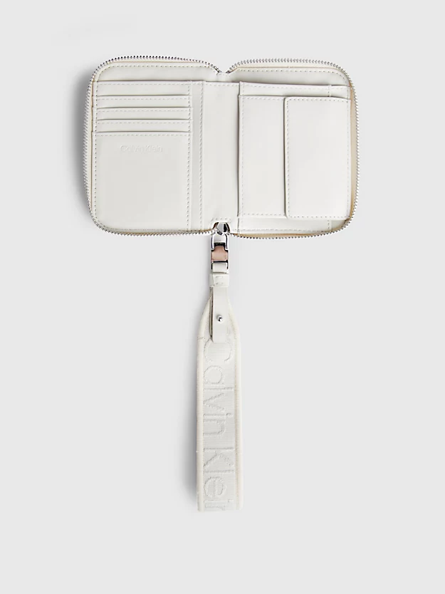 Carteira com zíper completo e porta-moedas de pulso com proteção RFID.