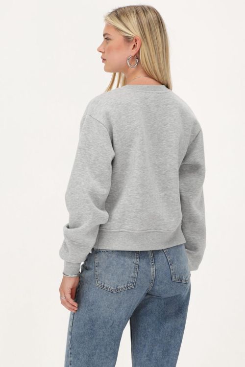 Grijze sweater met witte strikjes