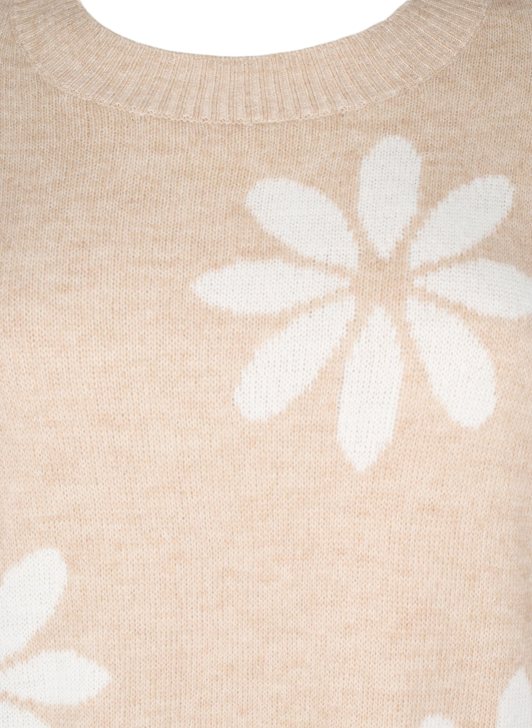 Strikbluse med blomster