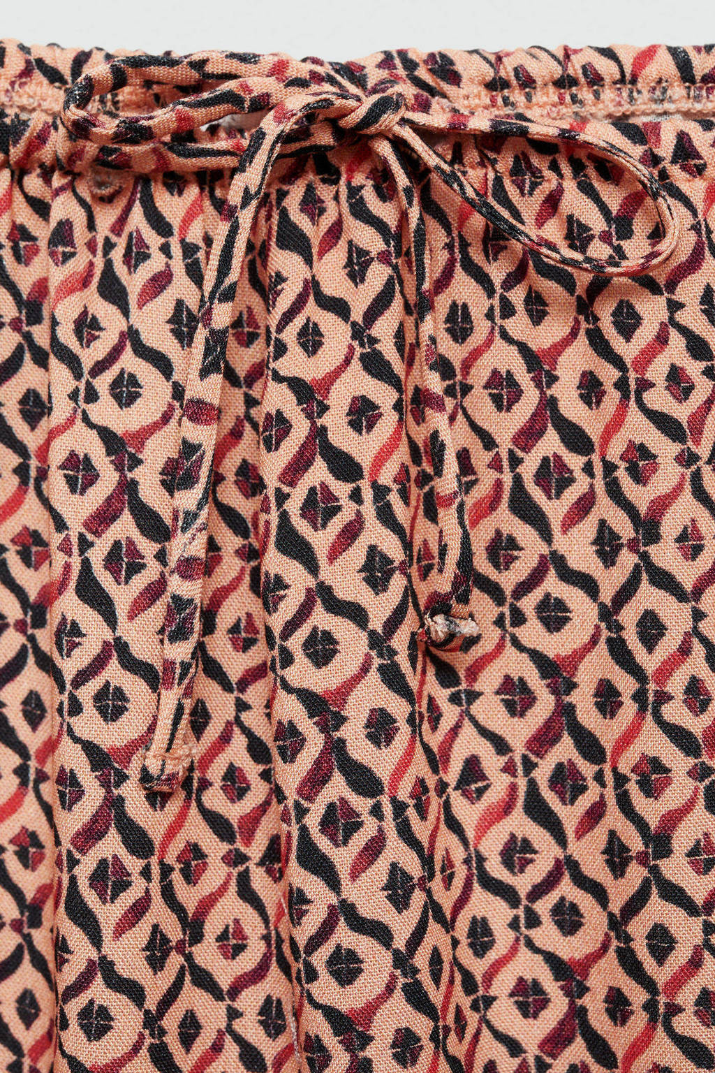 MANGO TEEN broek met all over print lichtoranje/zwart
