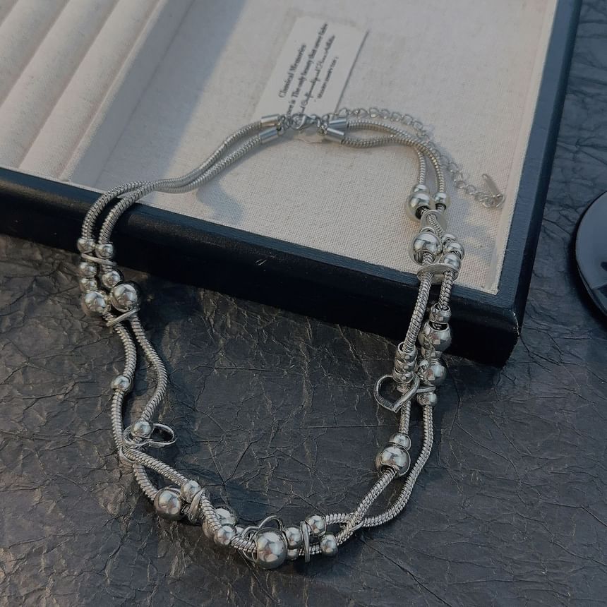 Catharsis - Hartvormige kralenketting met laagjes
