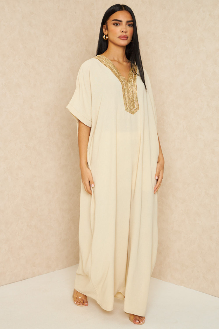 Abaya beige clair à broderies dorées