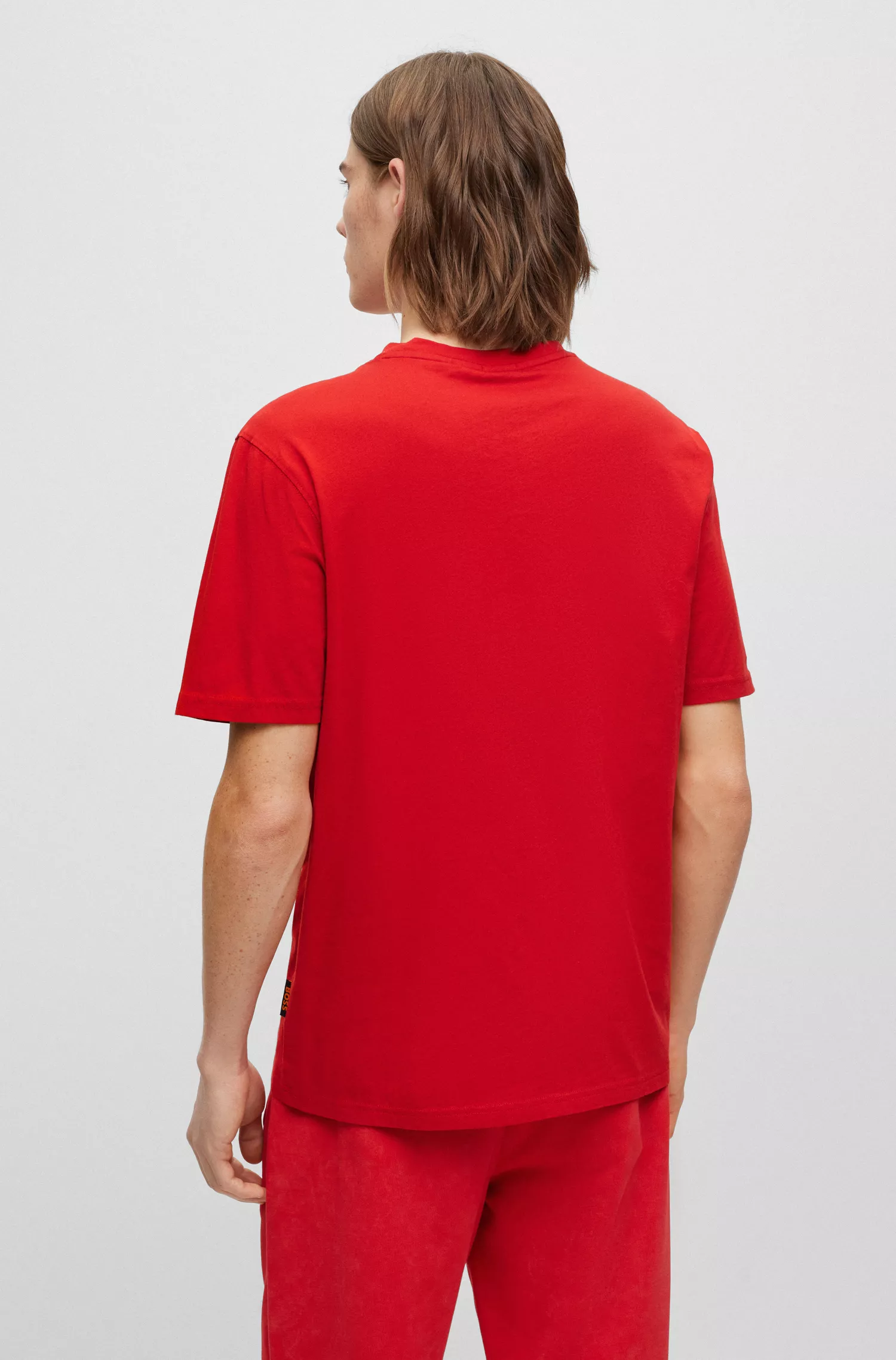 Camiseta BOSS laranja, modelagem relaxada, em algodão, com estampa de corrida de motos.